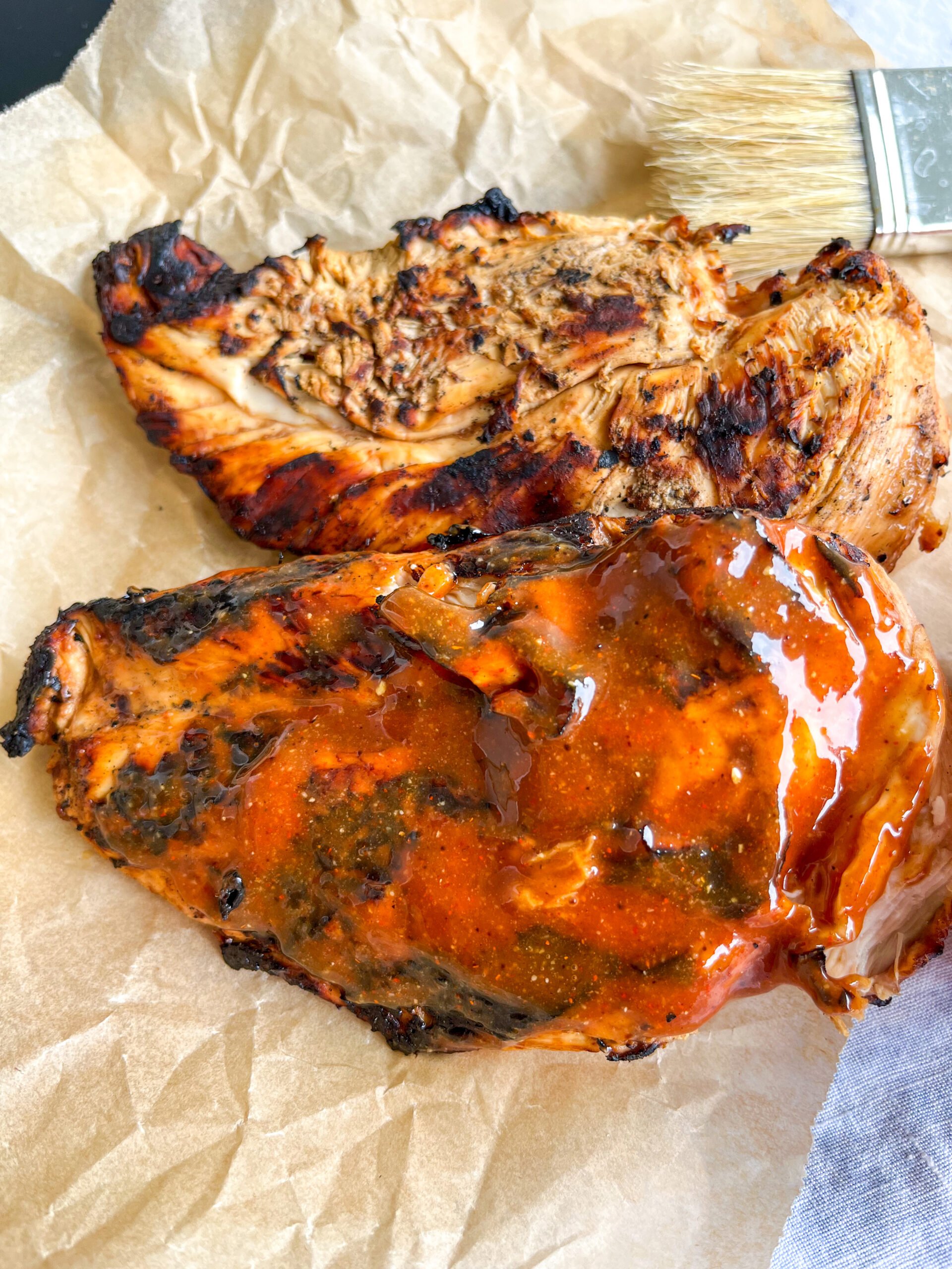 Grilled chicken with homemade barbecue sauce on it