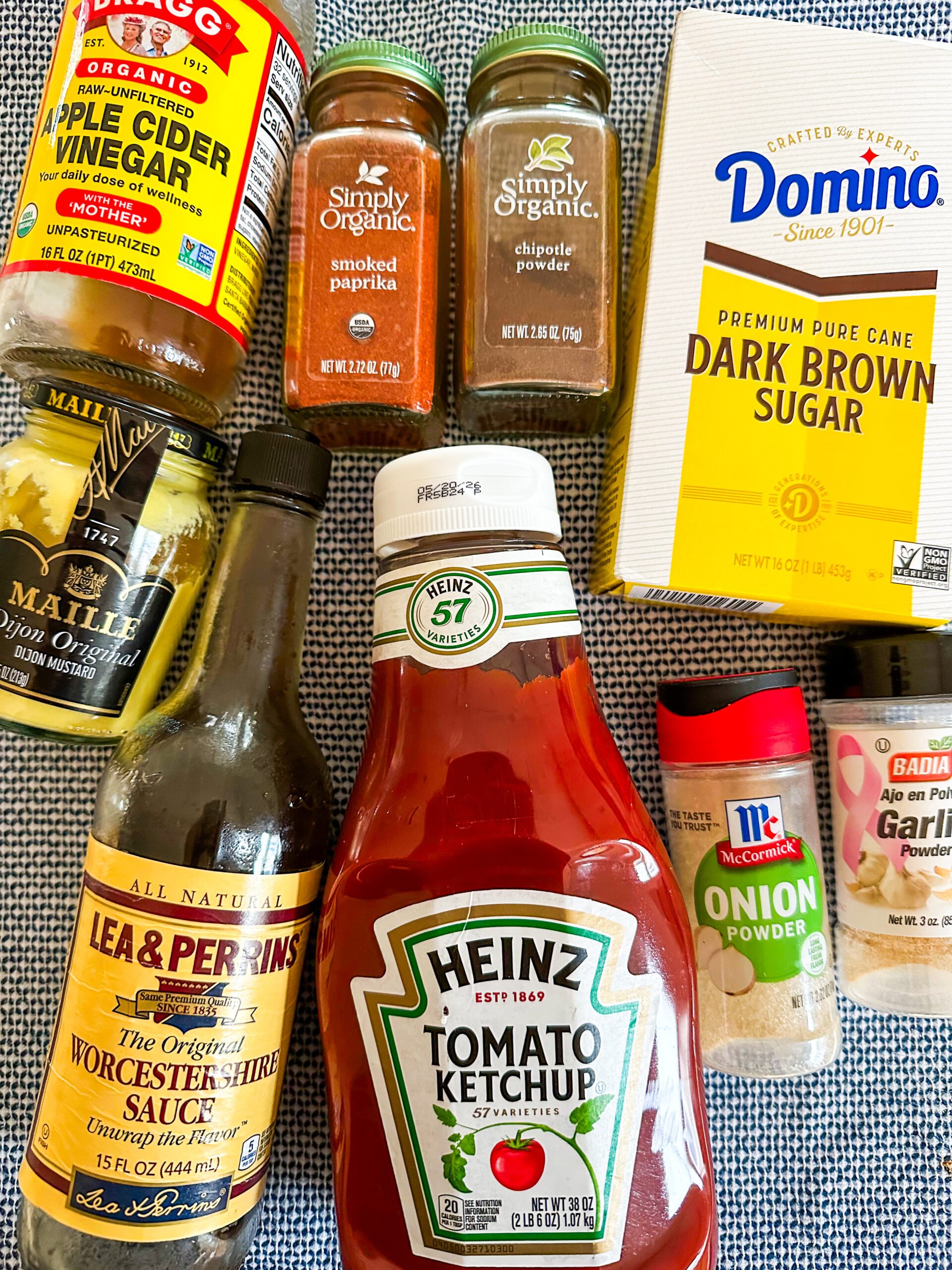 BBQ sauce ingredients laid out on a blue and white dish towel
