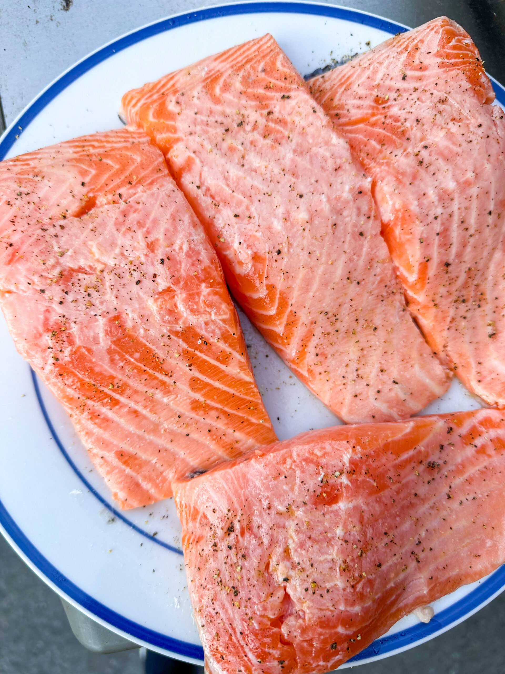 Salmon marinating briefly in lemon