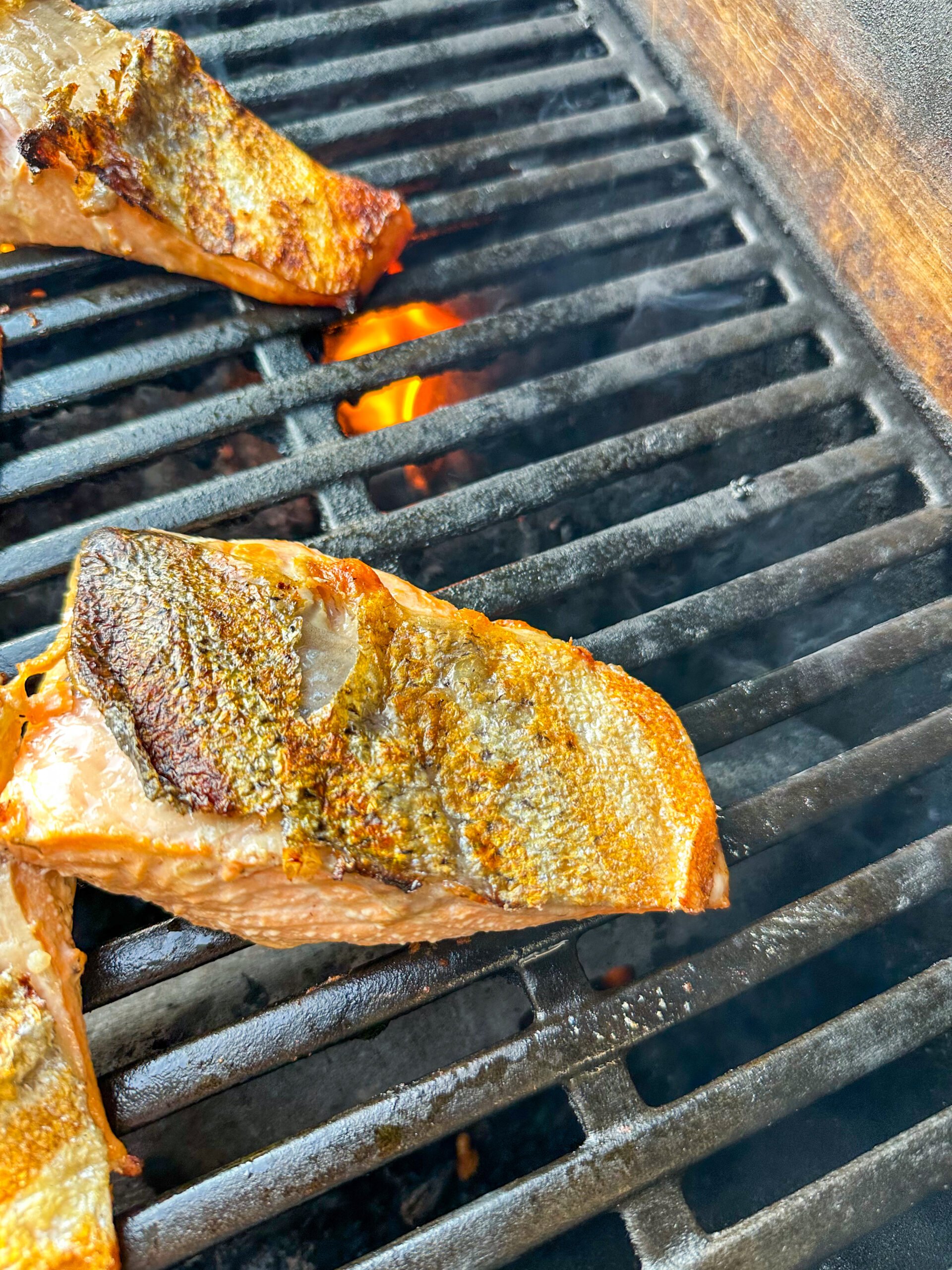 Salmon flipped so skin side is up on the grill