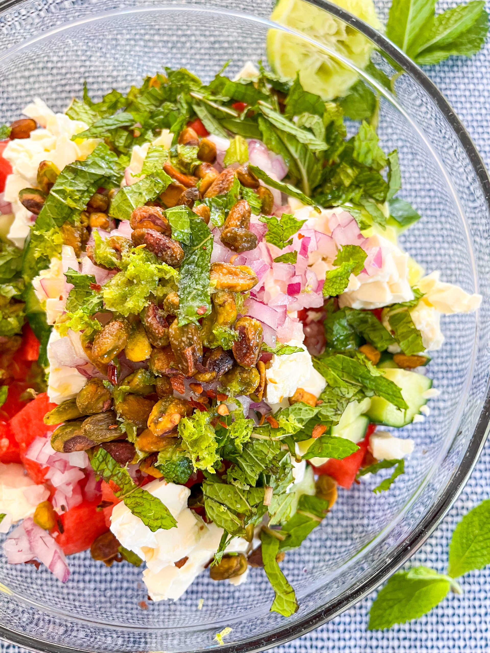 Watermelon feta salad before it's tossed in a clear bowl