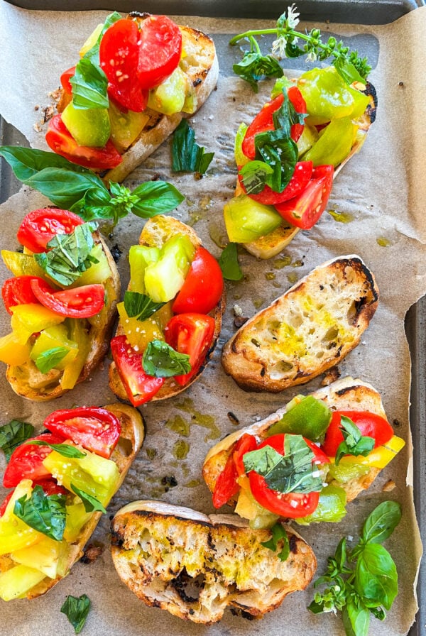 Bruschetta on a parchment lined sheet