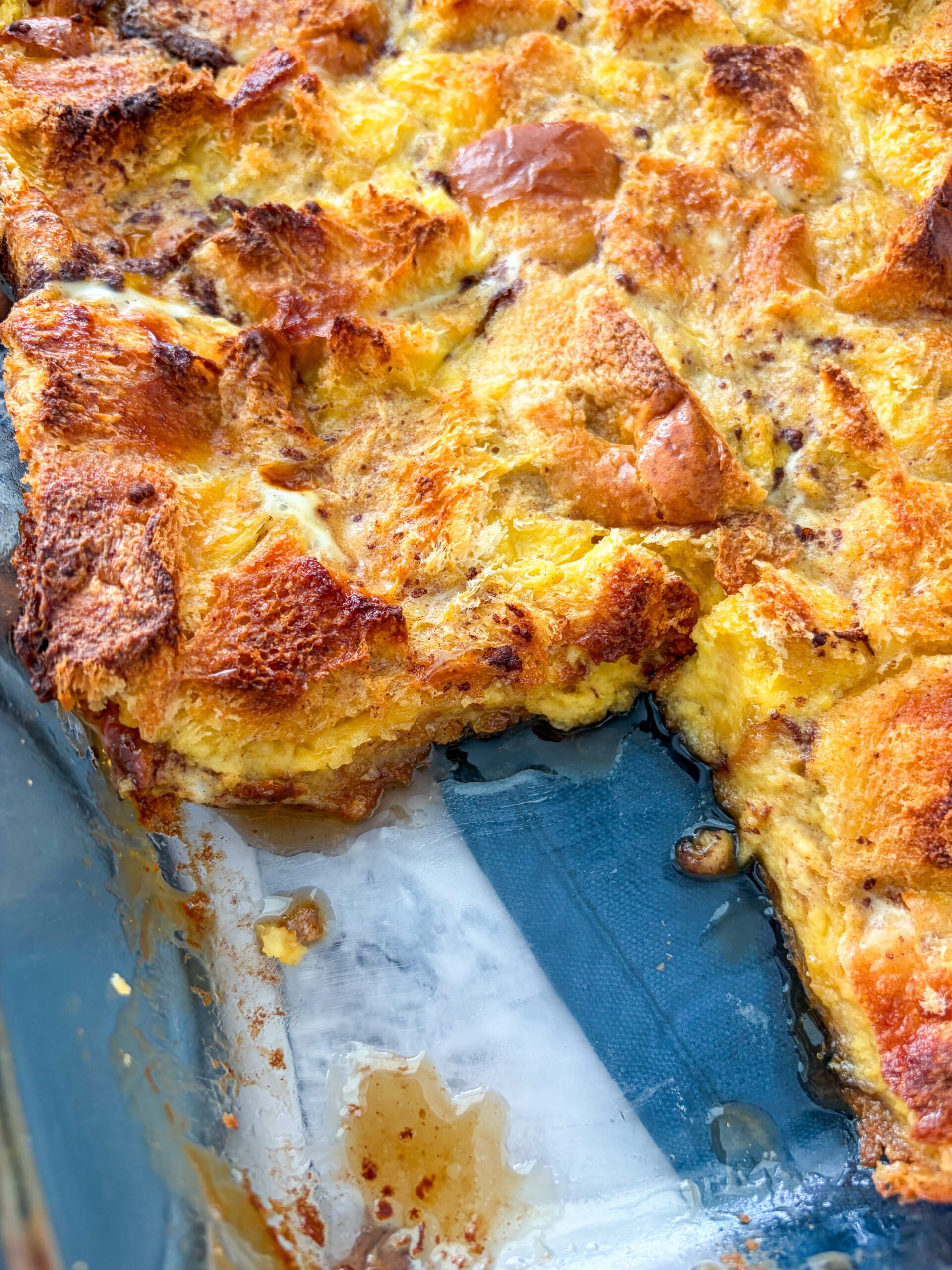 Close up of sliced bread pudding in the pan