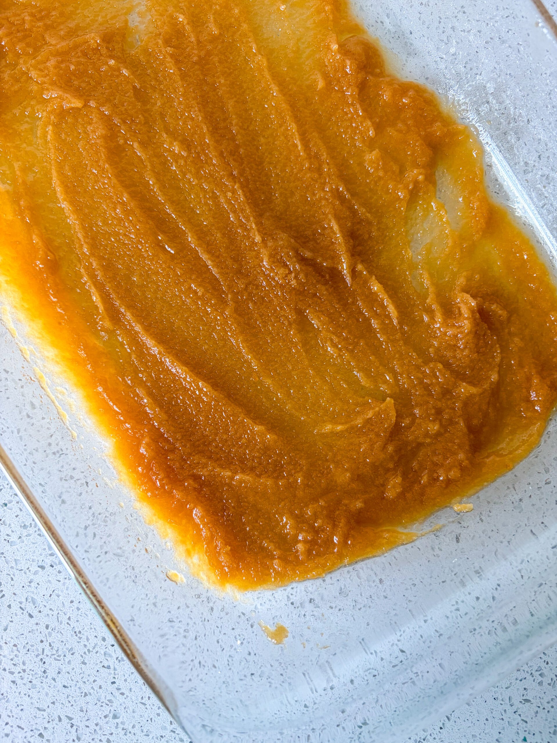 Butter, sugar and vanilla mixture spread in bottom of pan