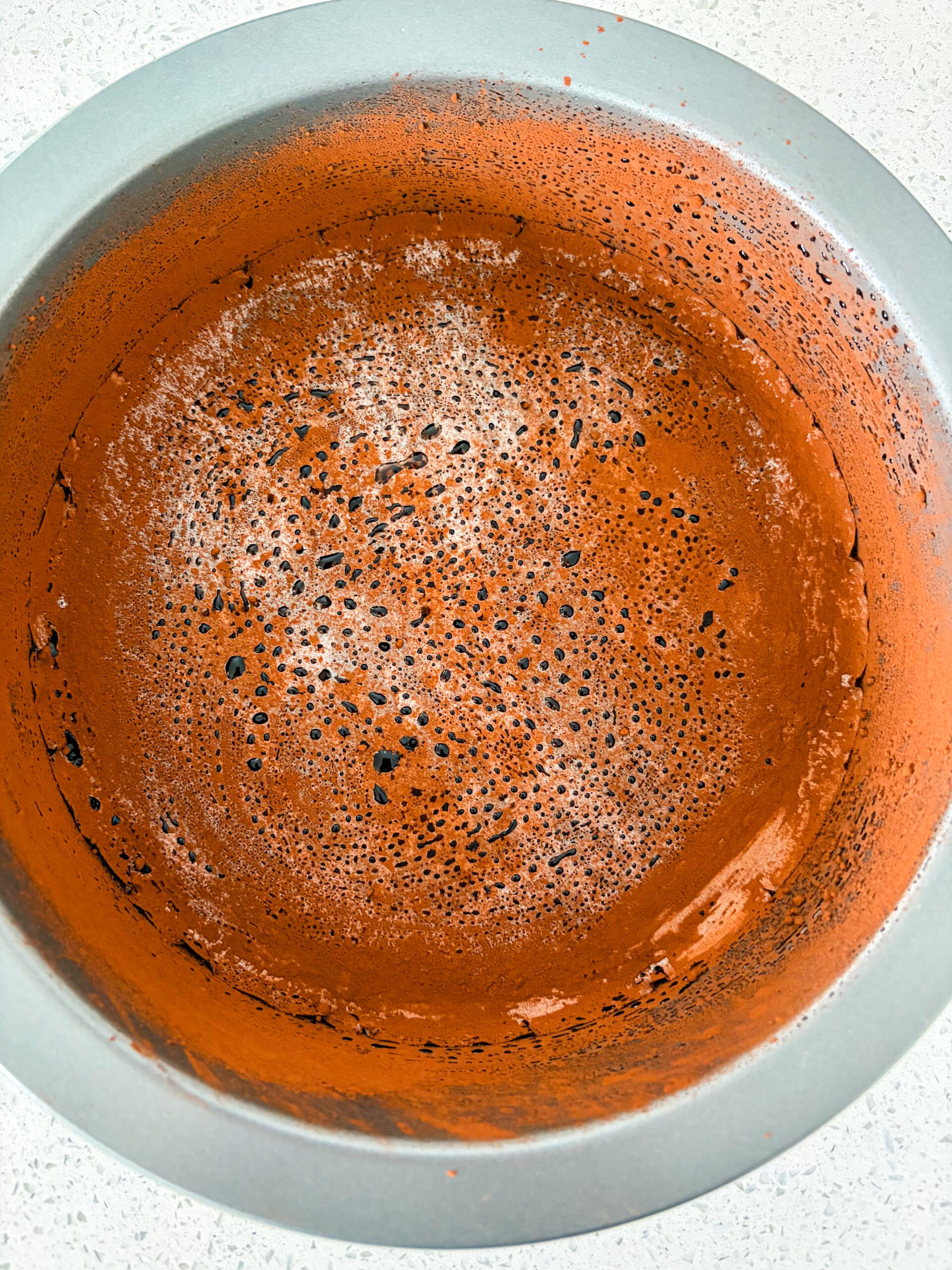 Greased and cocoa dusted cake pan