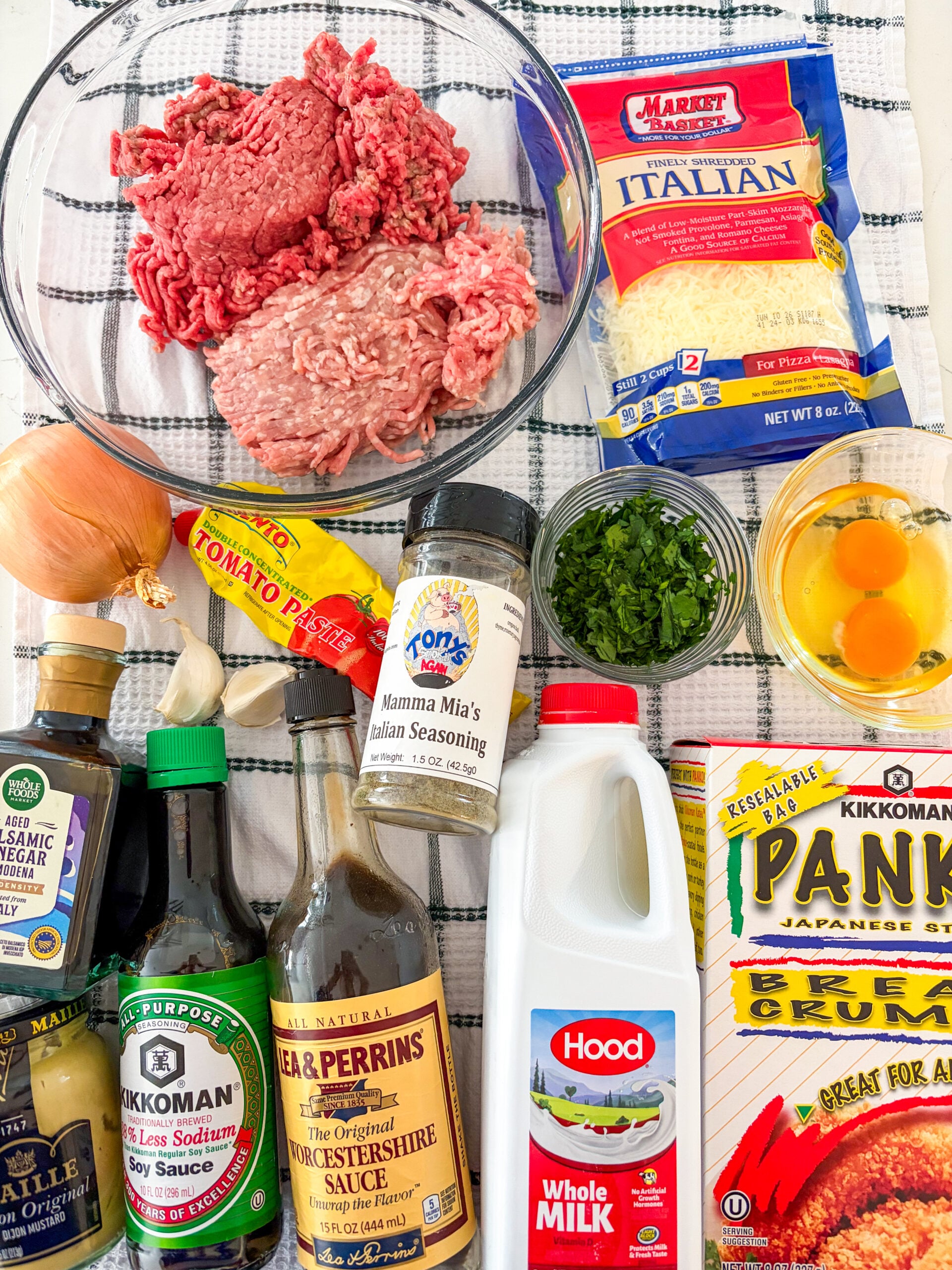 Meatloaf ingredients laid out of blue and white towel
