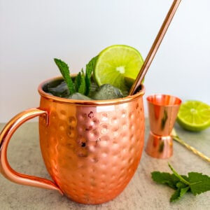 Moscow mule in a copper coper garnished with lime and mint