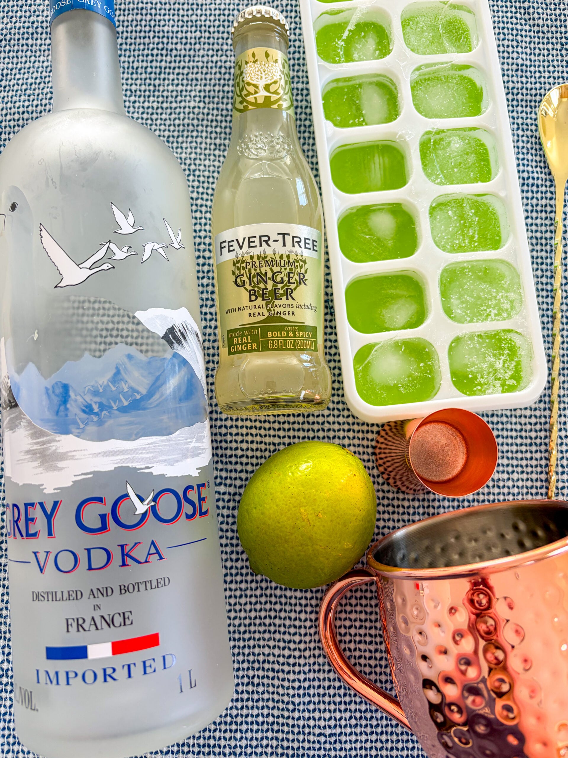 Moscow mule ingredients on a blue and white dish towel