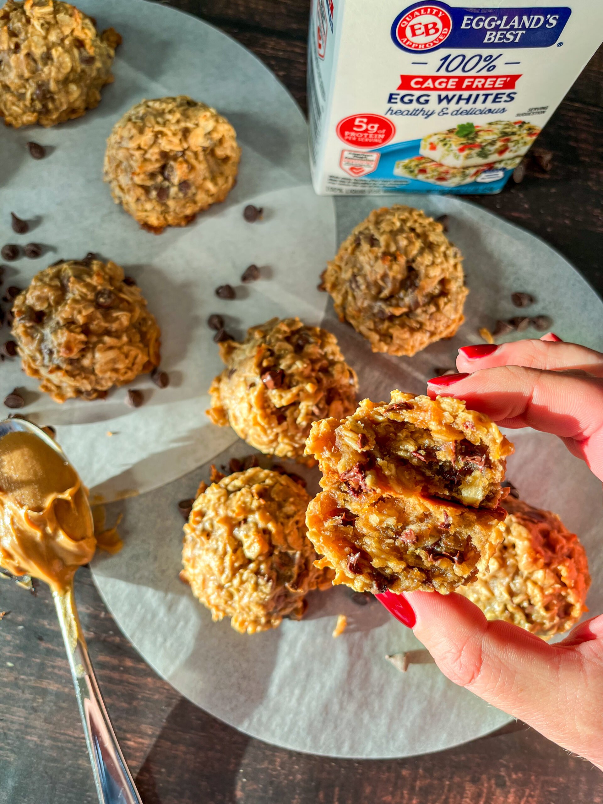 Holding up a cut in half protein ball in front of whole ones