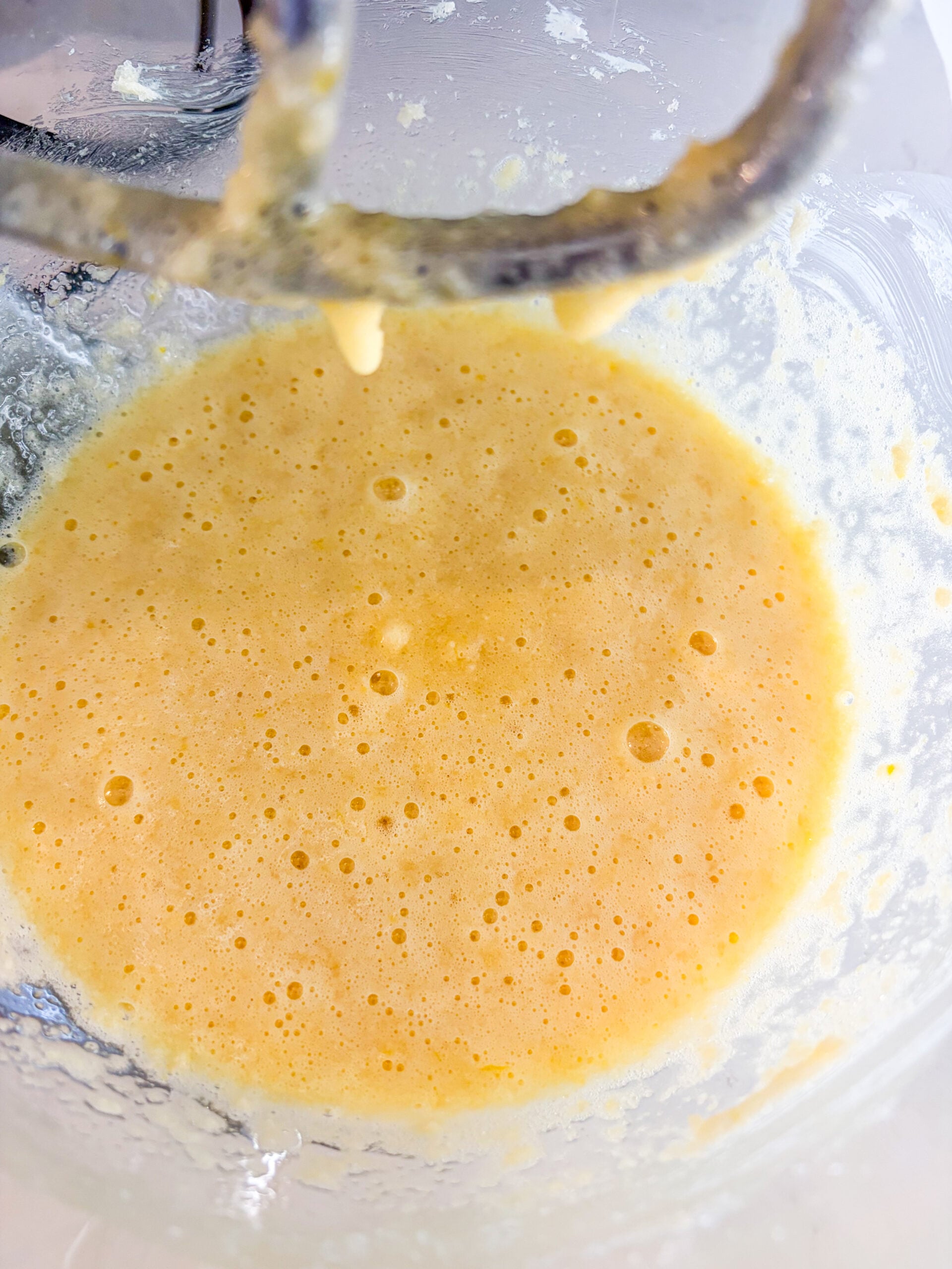 Sugar, butter, vanilla, salt, and eggs beaten together in bowl of mixer