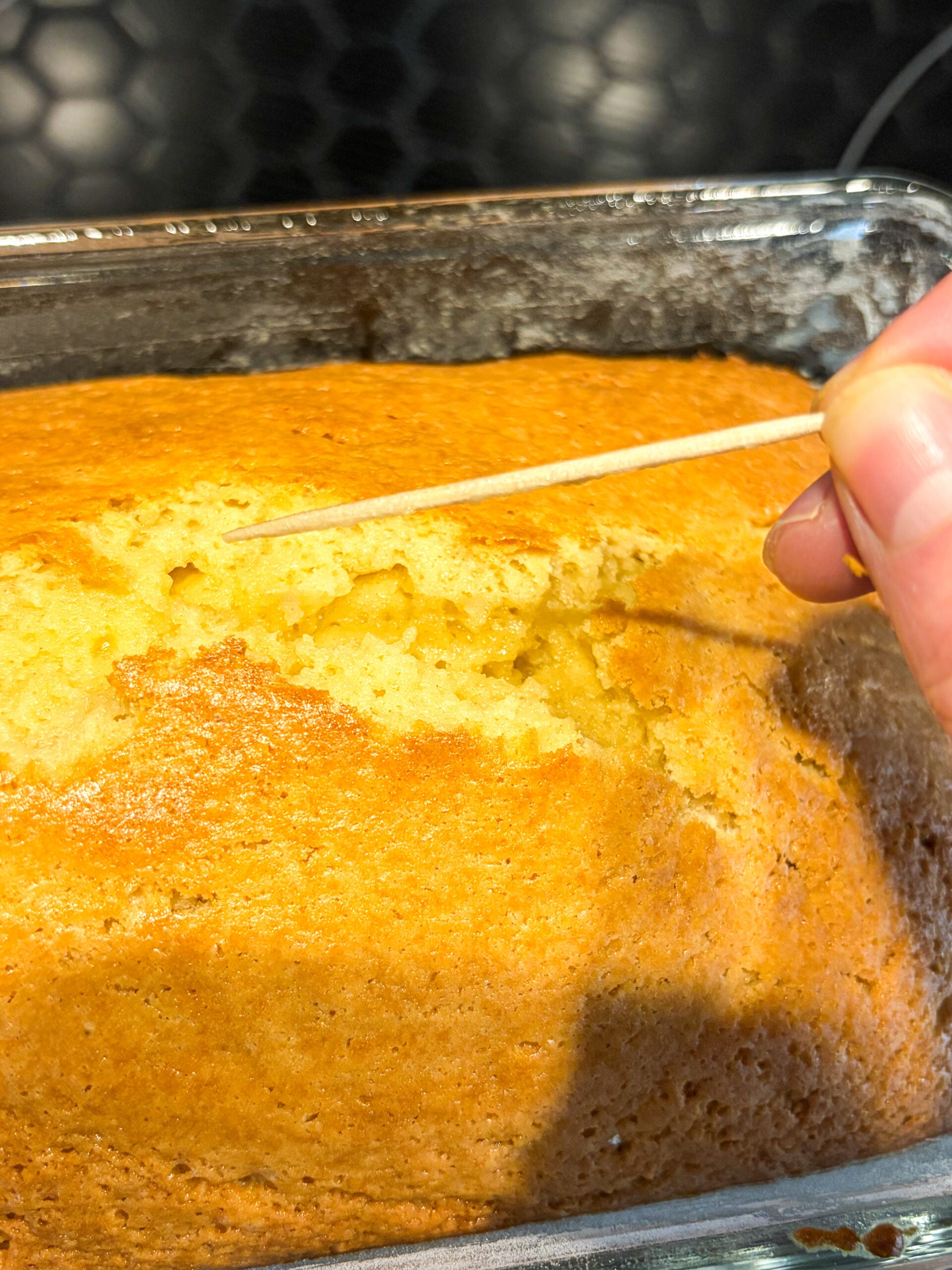 Testing cake with toothpick