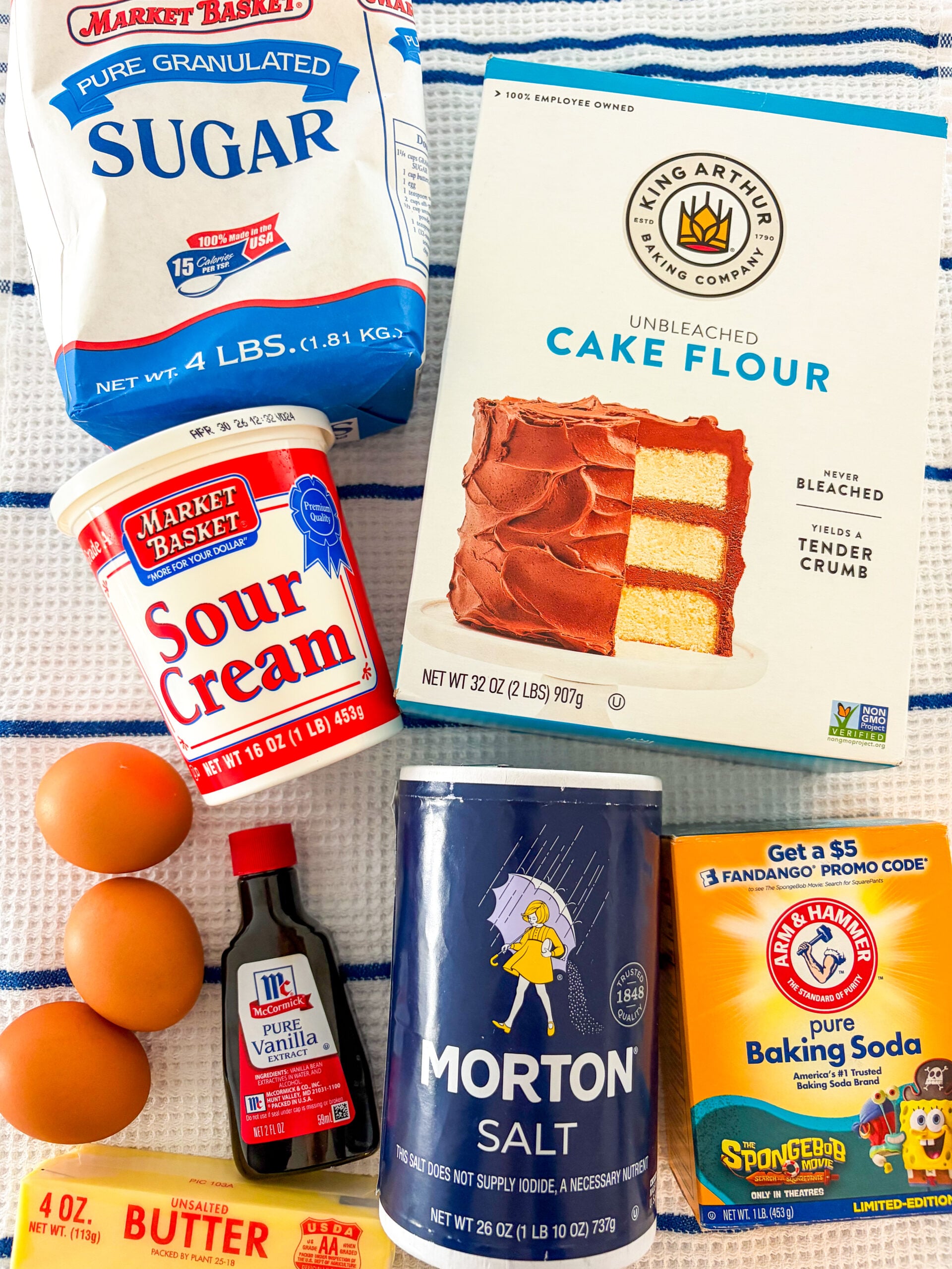 Pound cake ingredients on a blue and white dish towel