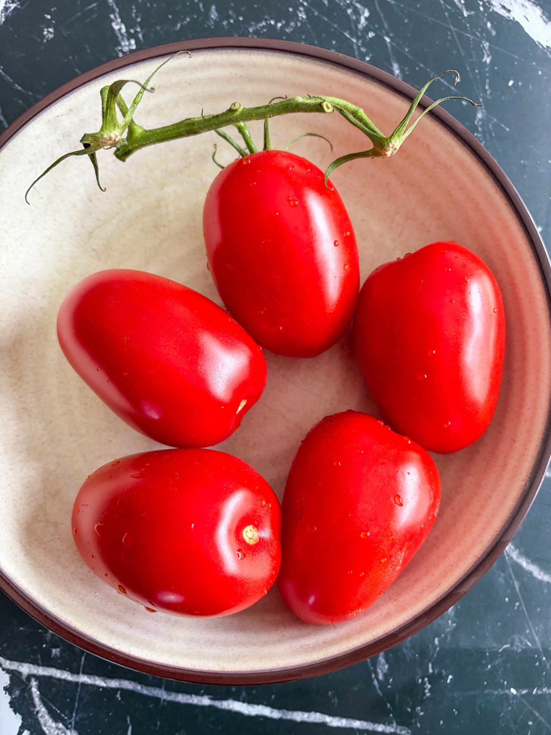 Roma tomatoes in a bowl