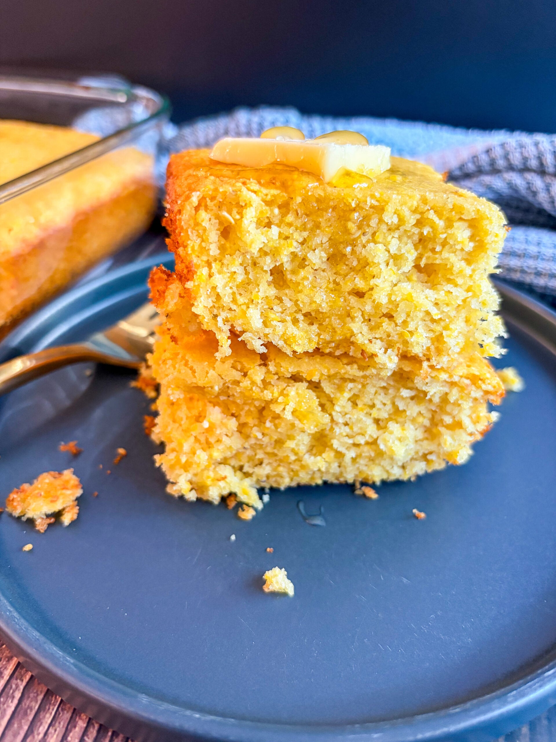 Slices of cornbread stacked with honey and butter