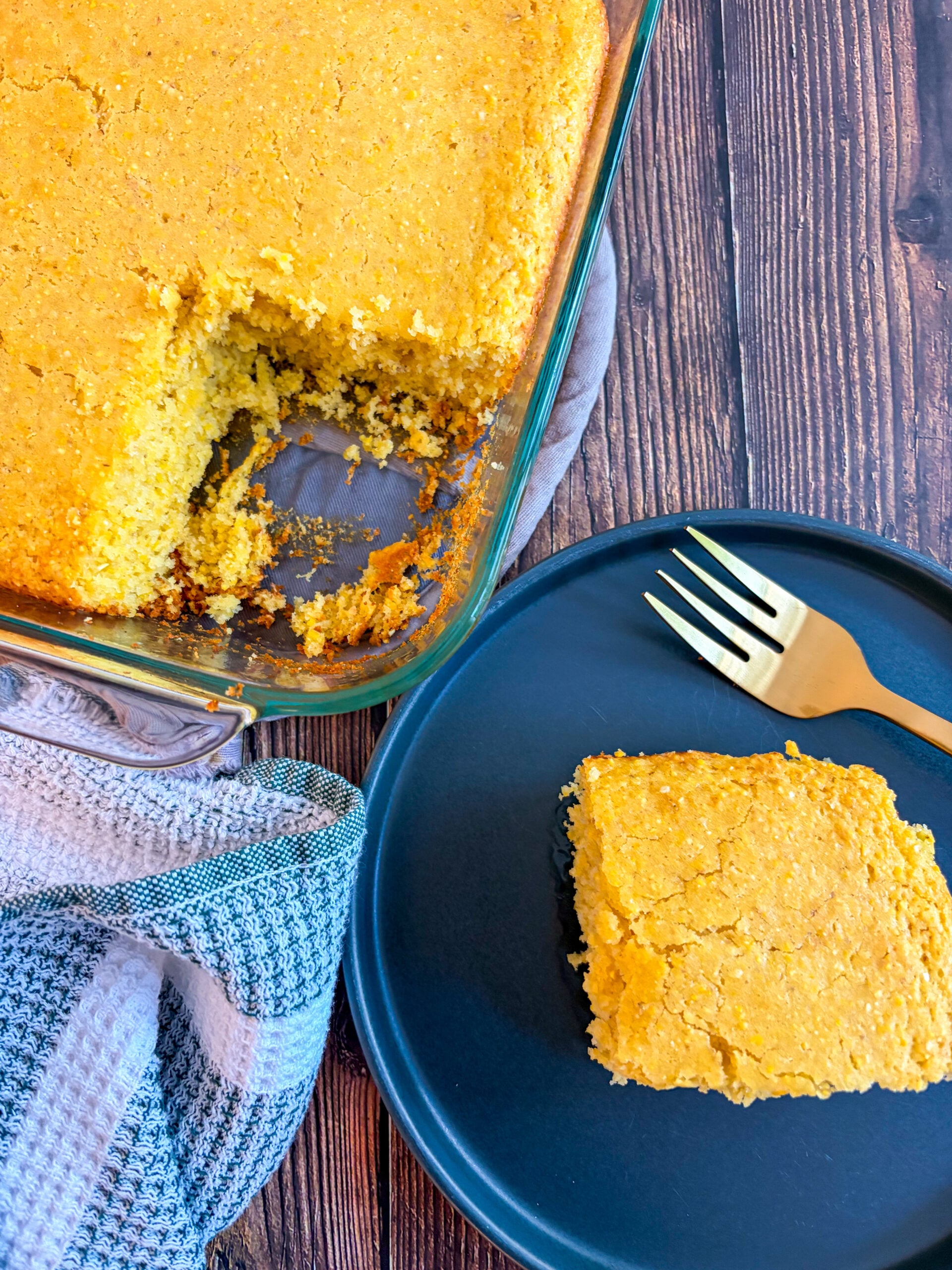 Over top shot of cornbread in pan and slice on plate