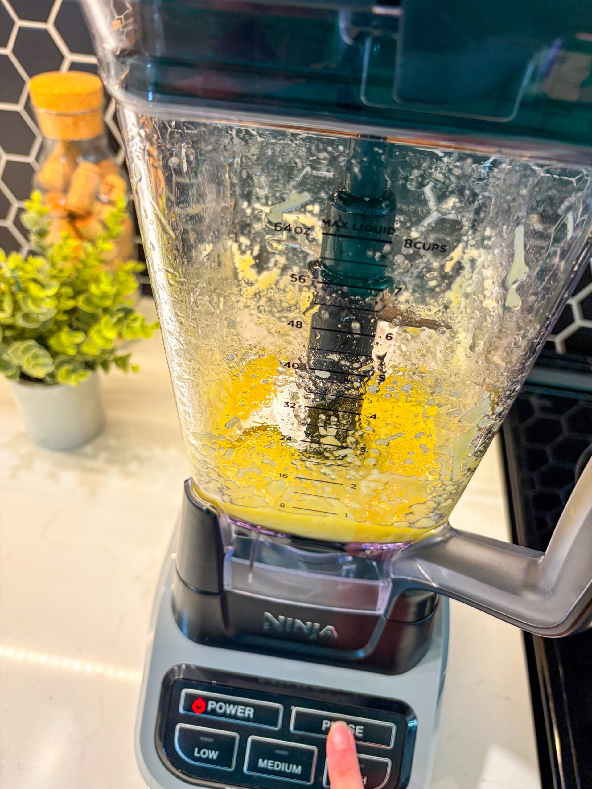 Garlic, olive oil, and cheese pulsed in a blender