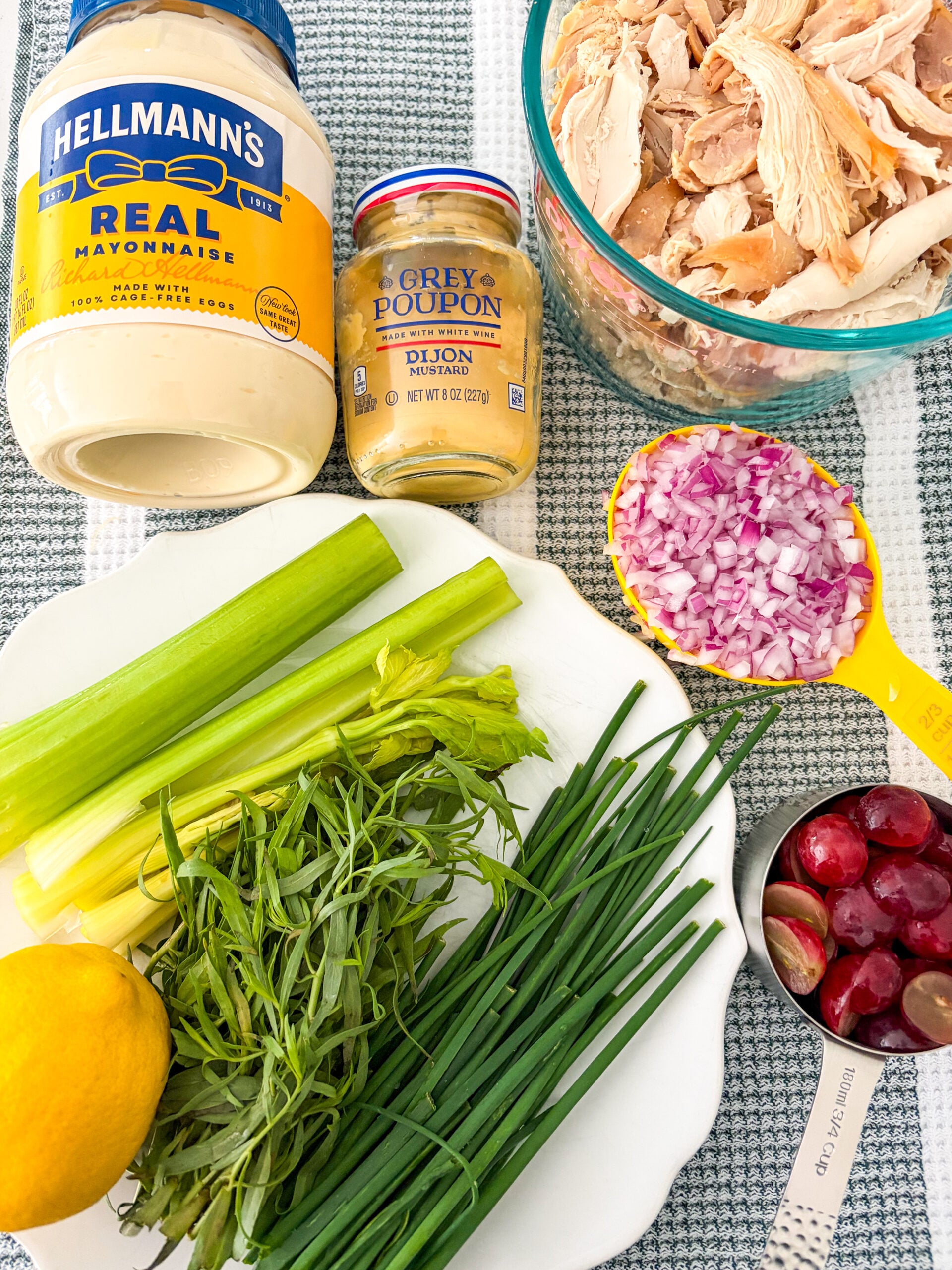Chicken salad recipe ingredients laid out on dish towel
