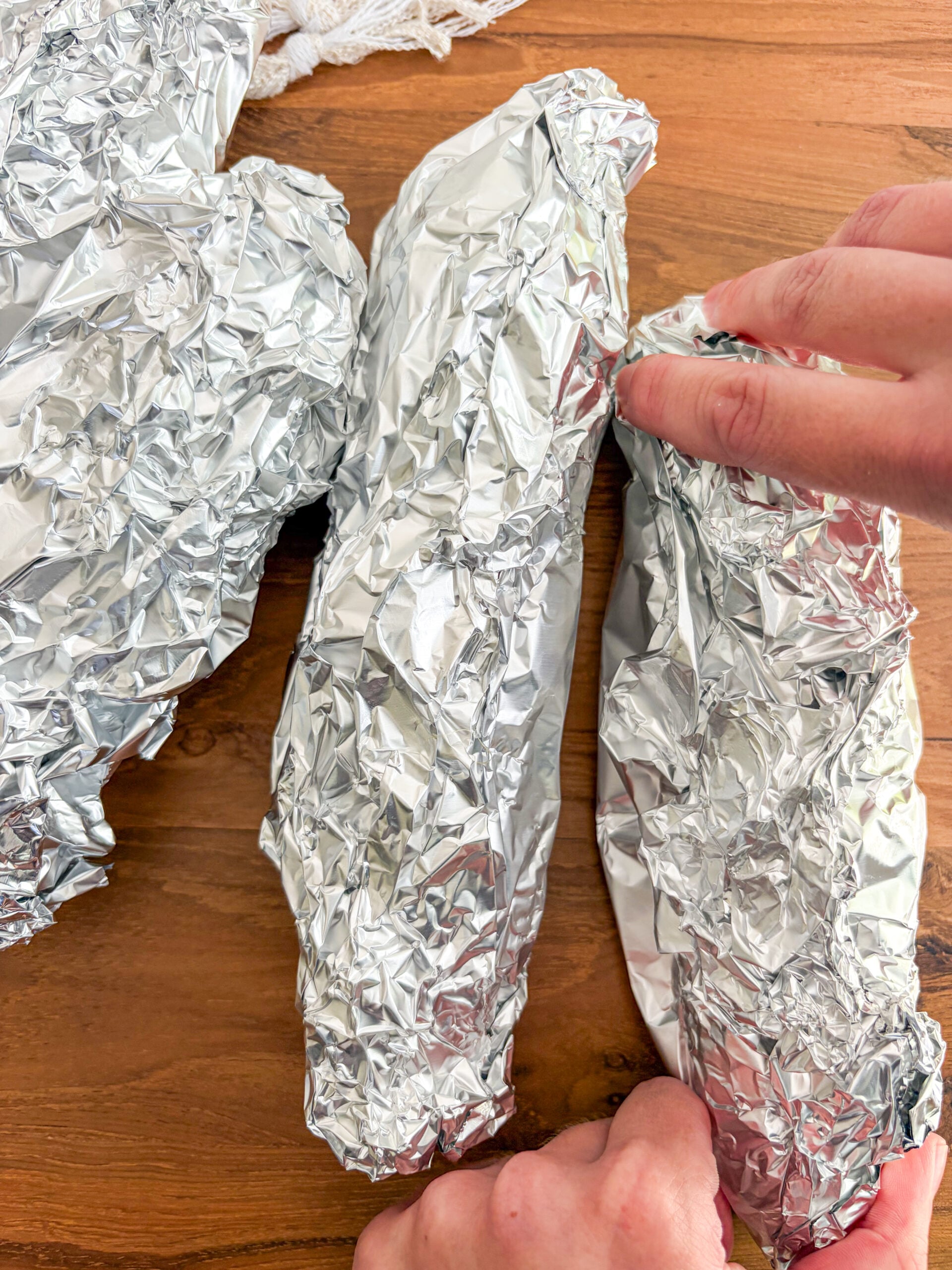 Wrapping each cob with foil