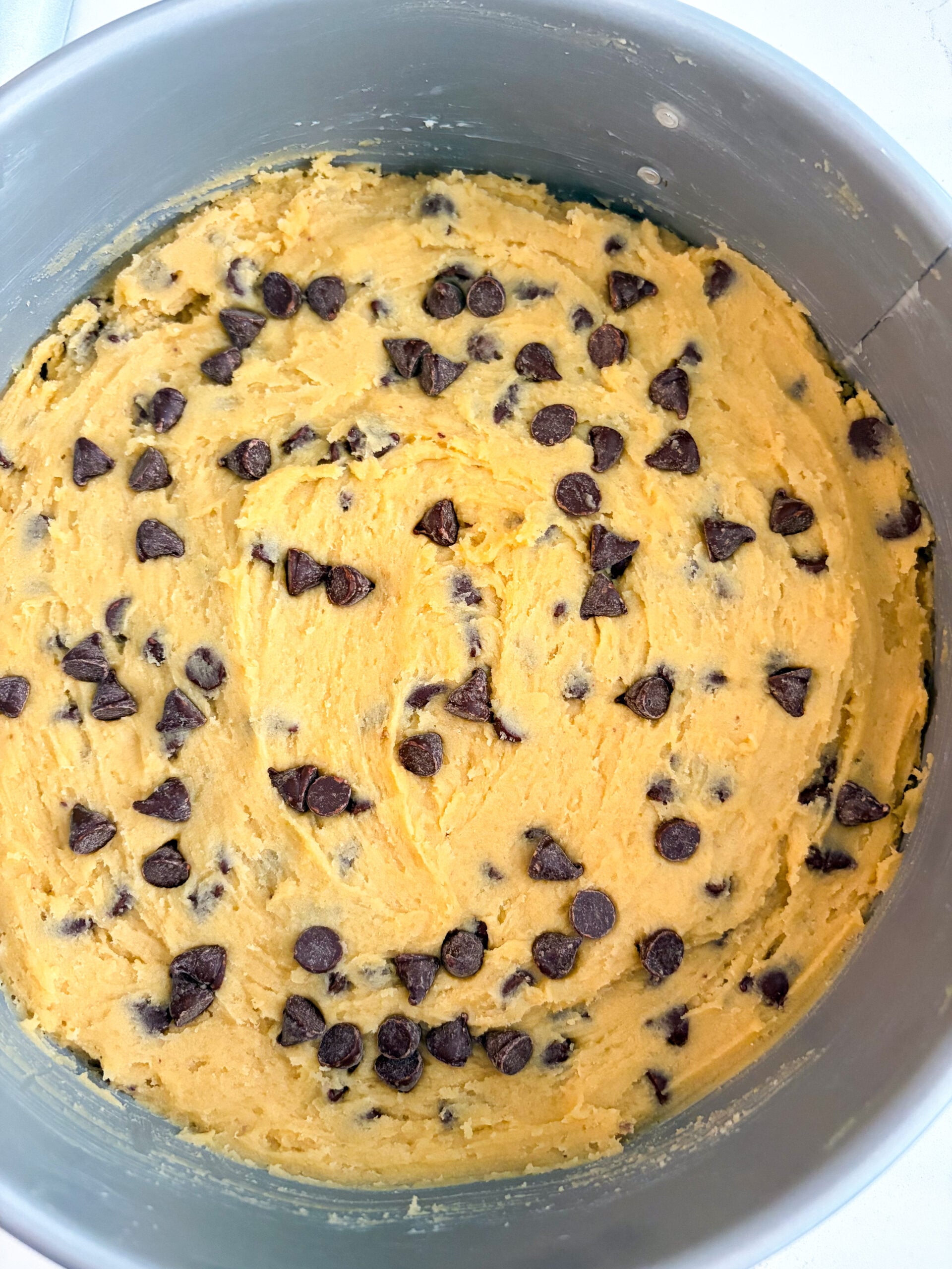 Cookie dough smoothed out in a springform pan