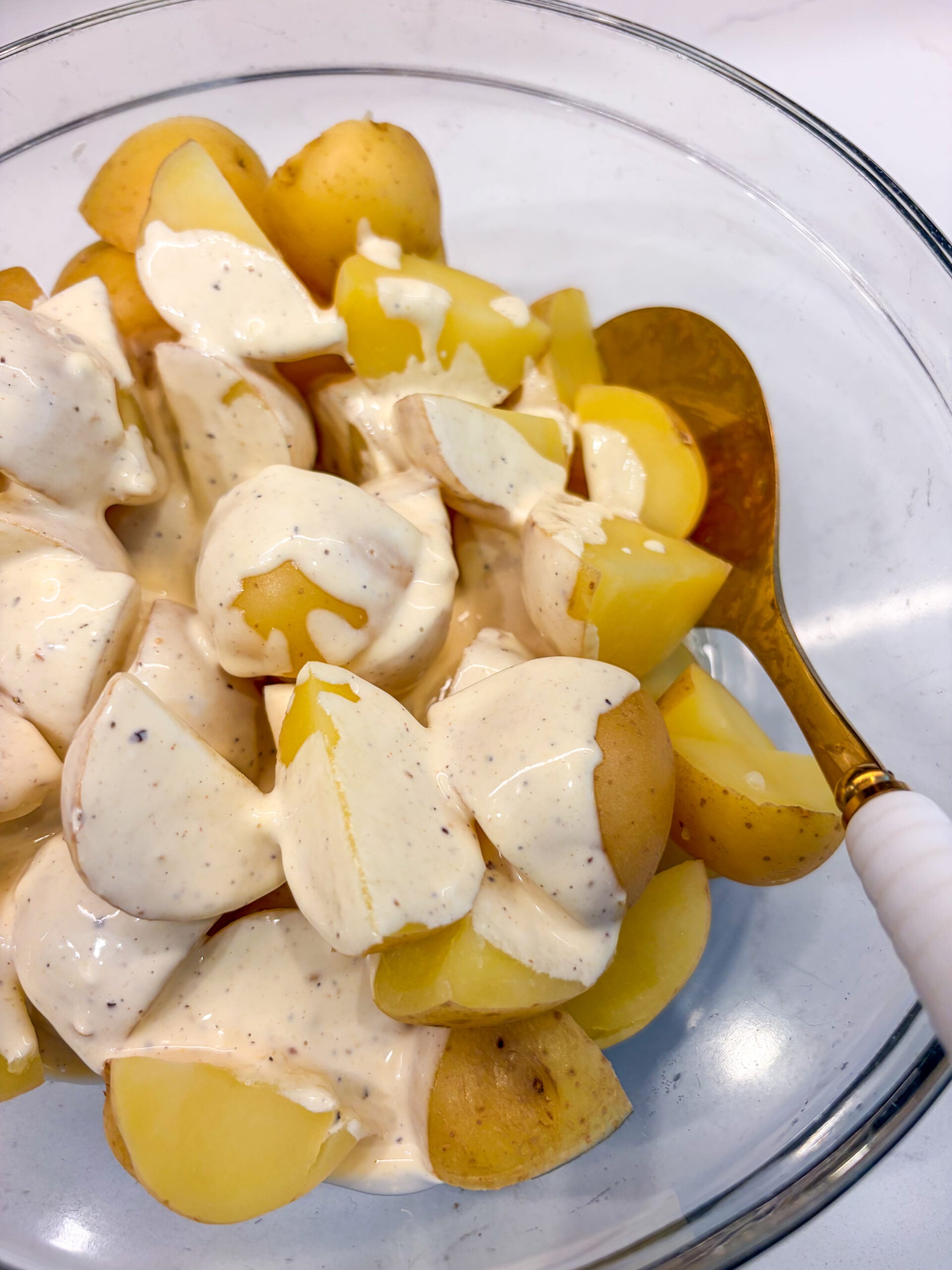 Dressing poured over potatoes