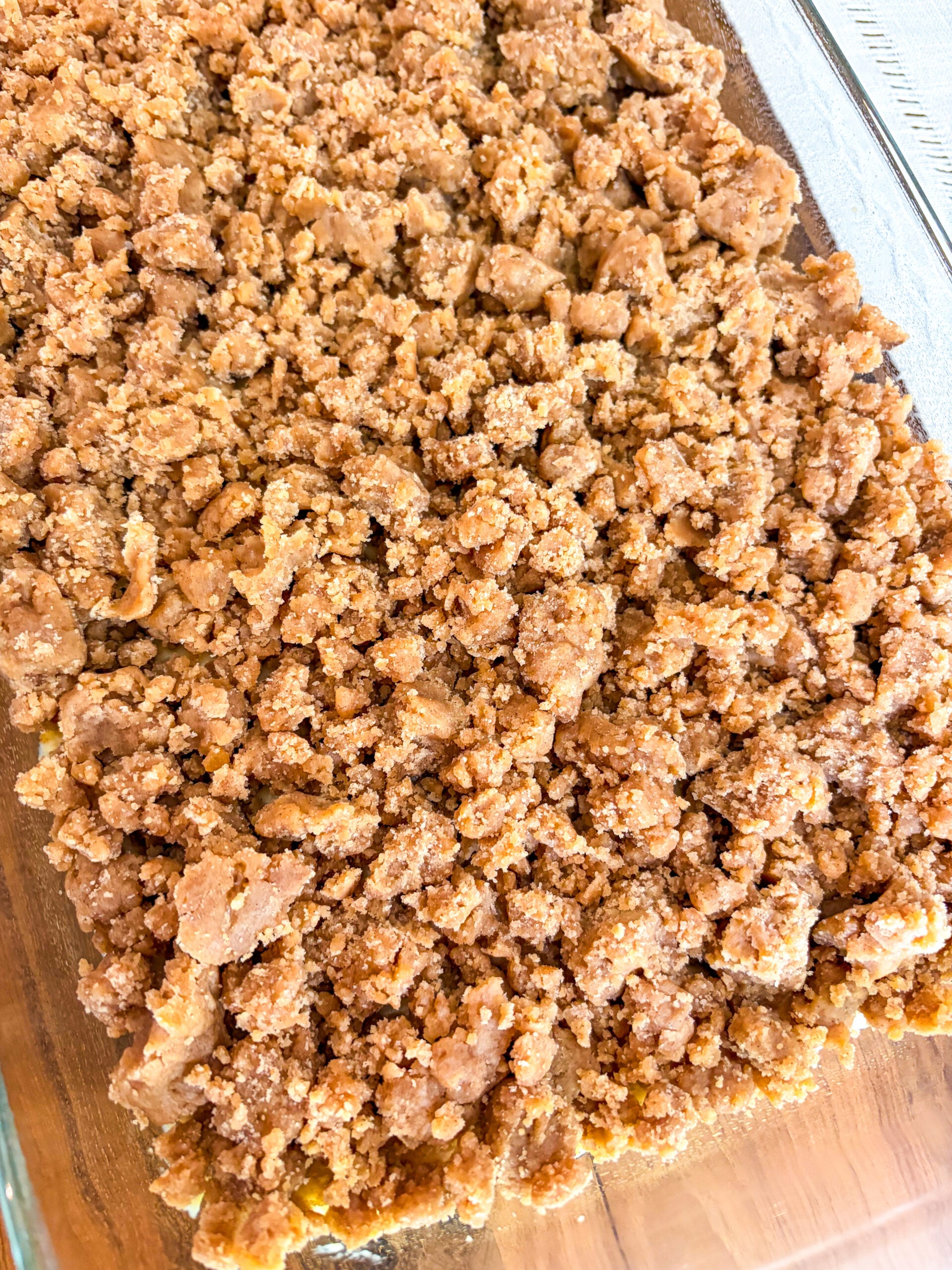 Coffee cake assembled in glass pan, about to go in oven