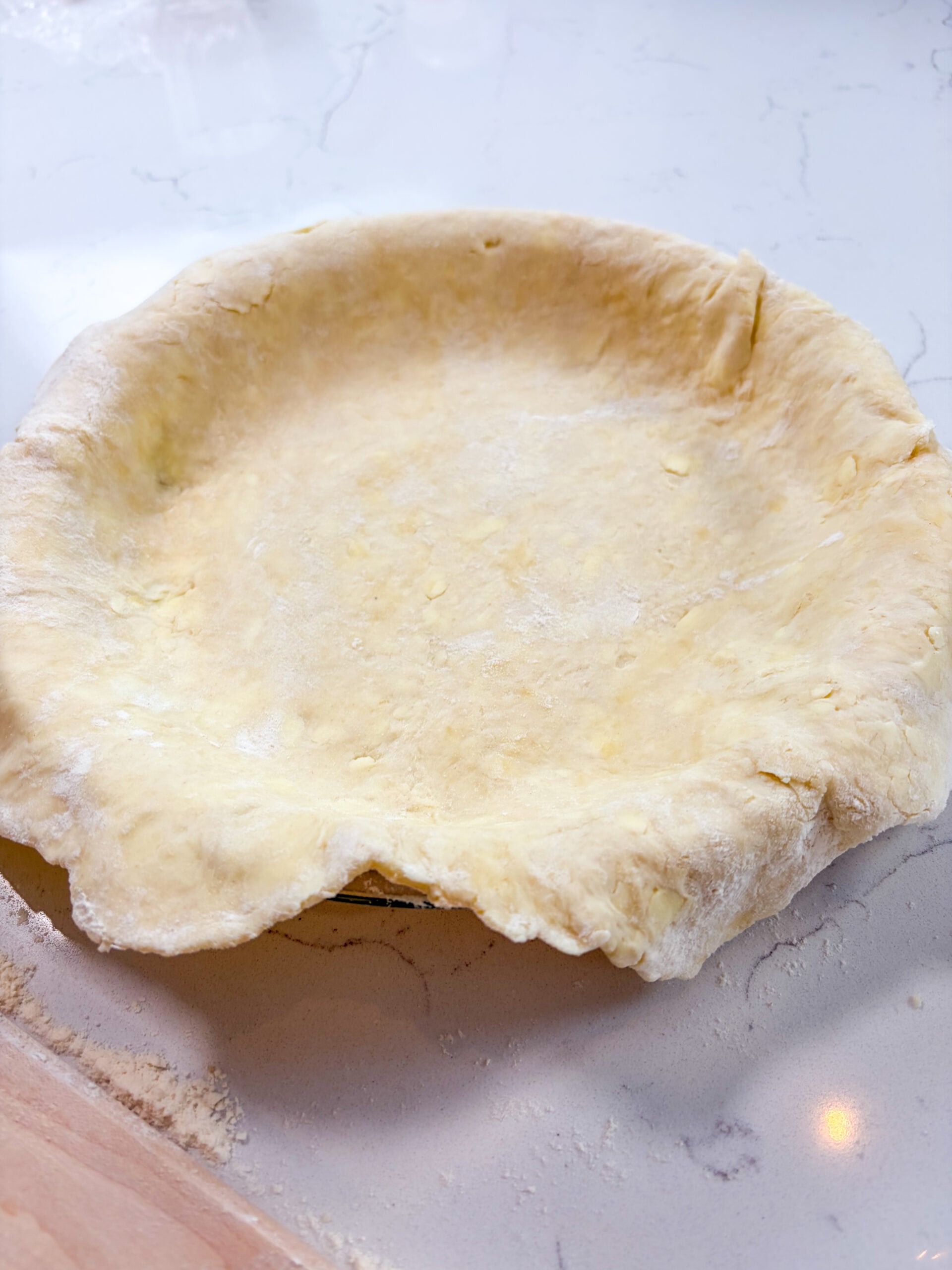 Bottom pie crust rolled out in pie plate