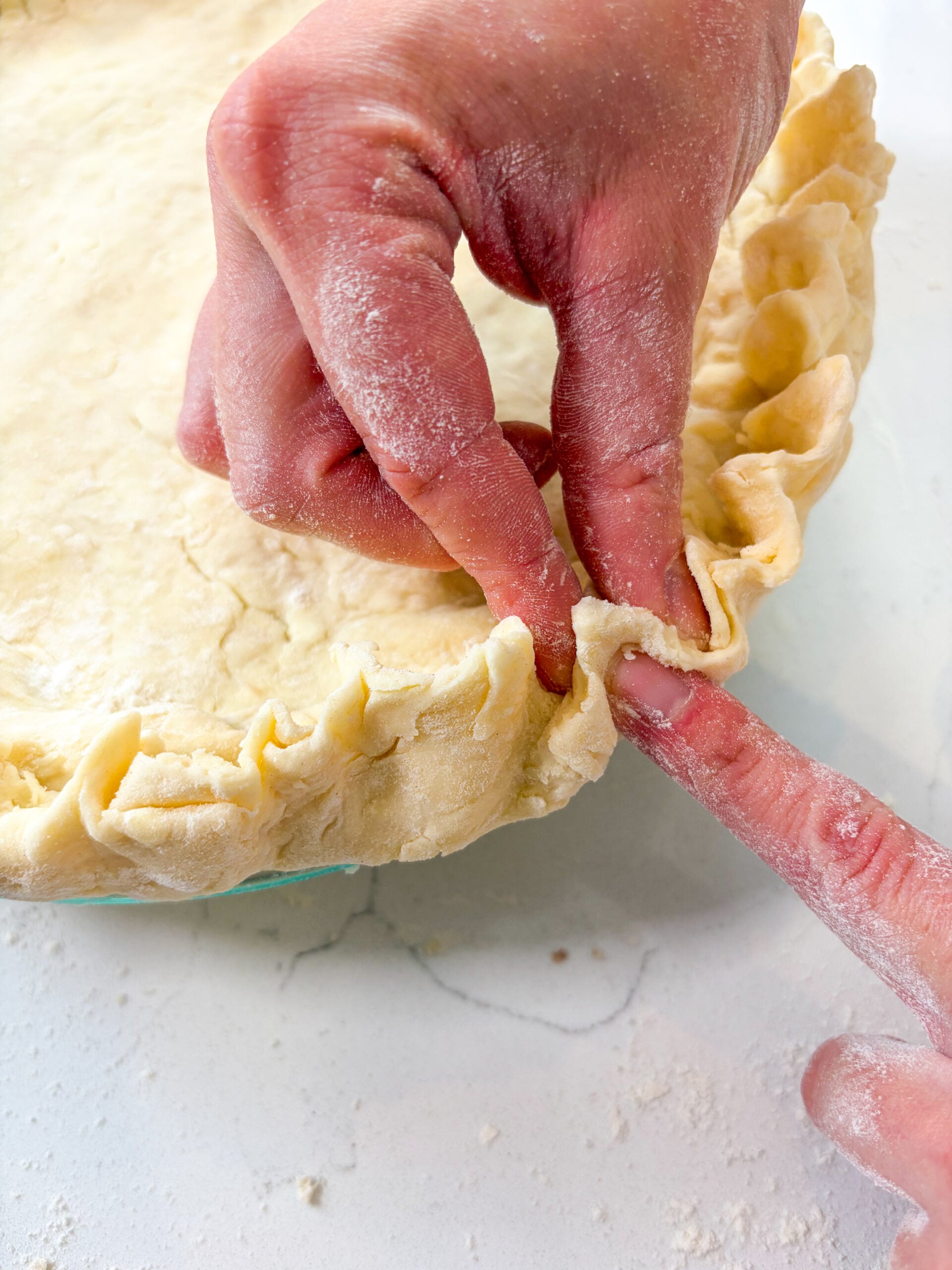 Top and bottom crust being crimped together