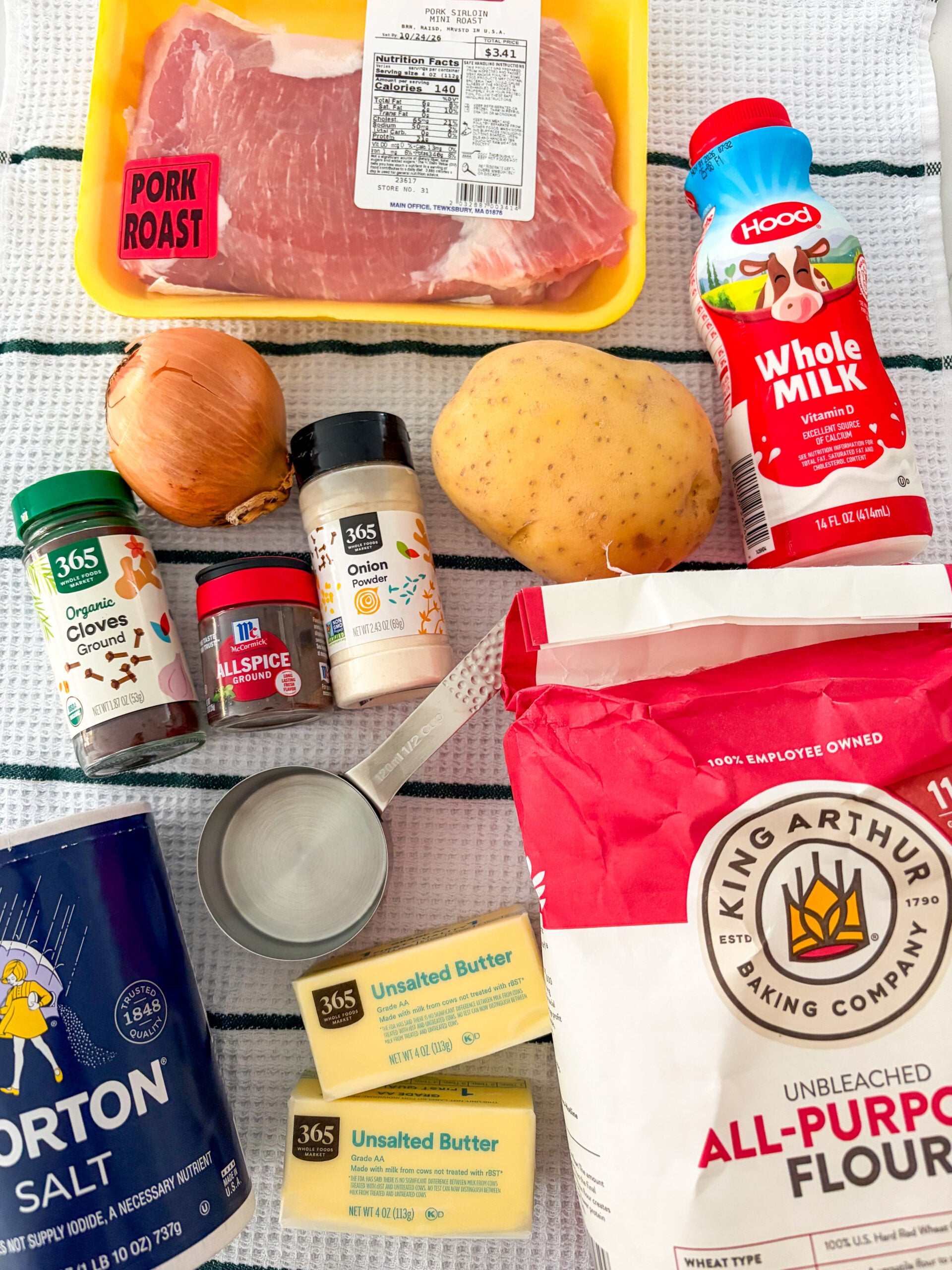 Tourtiere recipe ingredients laid out on dish towel
